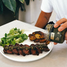 Grilled steak topped with chimichurri sauce
